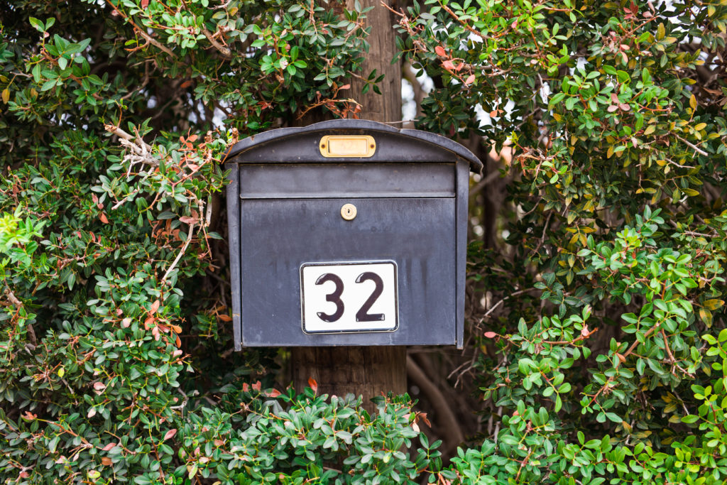 mail box for newspapers and letters near the house.