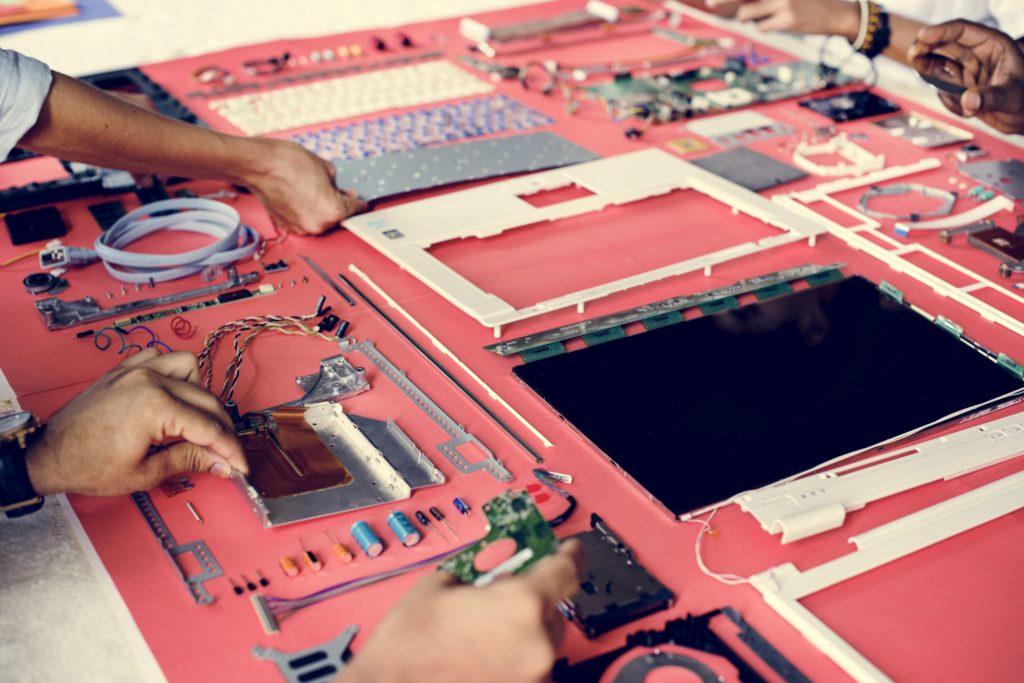 Hands holding a computer component part